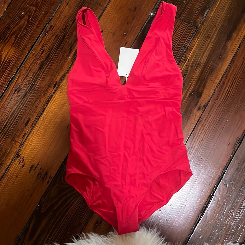 Super flattering RED one piece bathing suit from “& other stories”still has tag!
